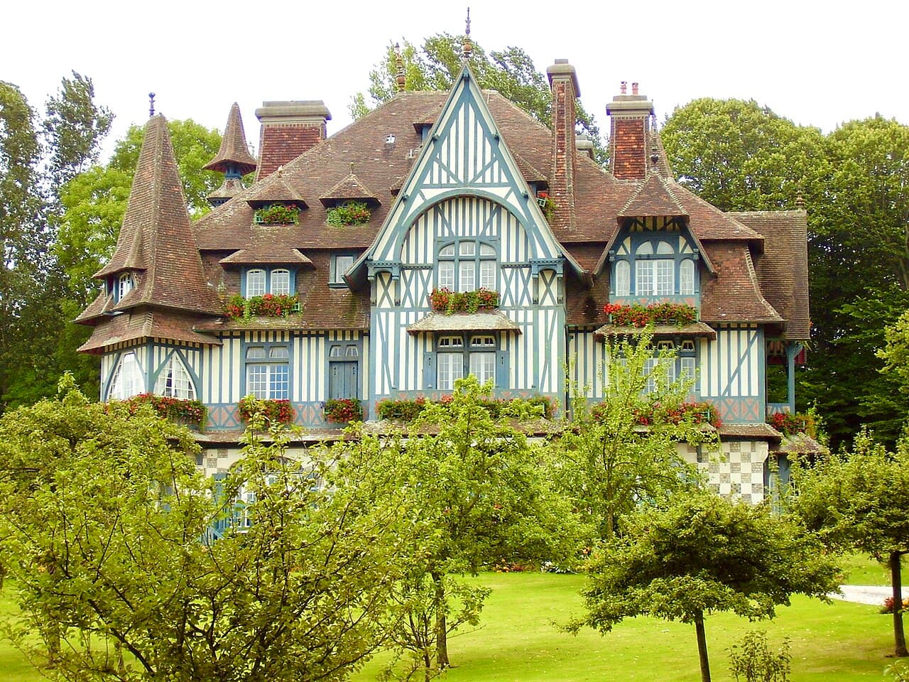 A half-timbered Norman manor house with flowered balconies in Deauville